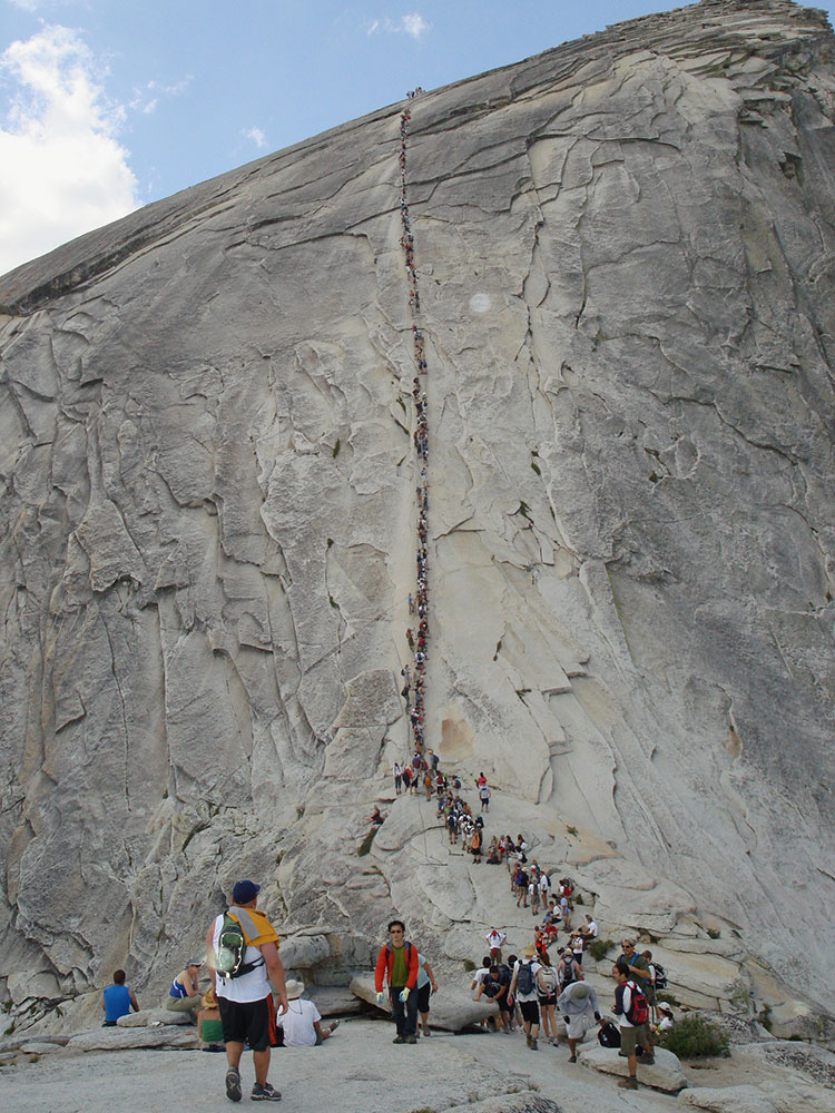 Line of hikers on the Half Dome cable route